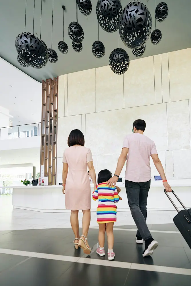 Family traveling together arriving at hotel